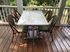 calcutta quartz patio table with textiline bistro chairs